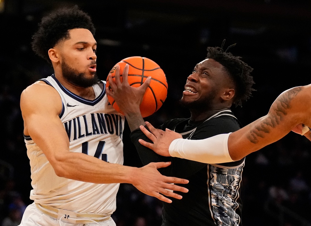 Mar 8, 2023; New York, NY, USA; Georgetown Hoyas guard Jay Heath (5) is stopped by Villanova Wildcats guard Caleb Daniels (14) in the second half at Madison Square Garden. Mandatory Credit: Robert Deutsch-USA TODAY Sports