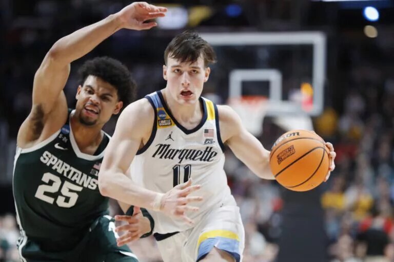 Mar 19, 2023; Columbus, OH, USA; Marquette Golden Eagles guard Tyler Kolek (11) dribbles the ball defended by Michigan State Spartans forward Malik Hall (25) in the second half at Nationwide Arena. Mandatory Credit: Joseph Maiorana-USA TODAY Sports