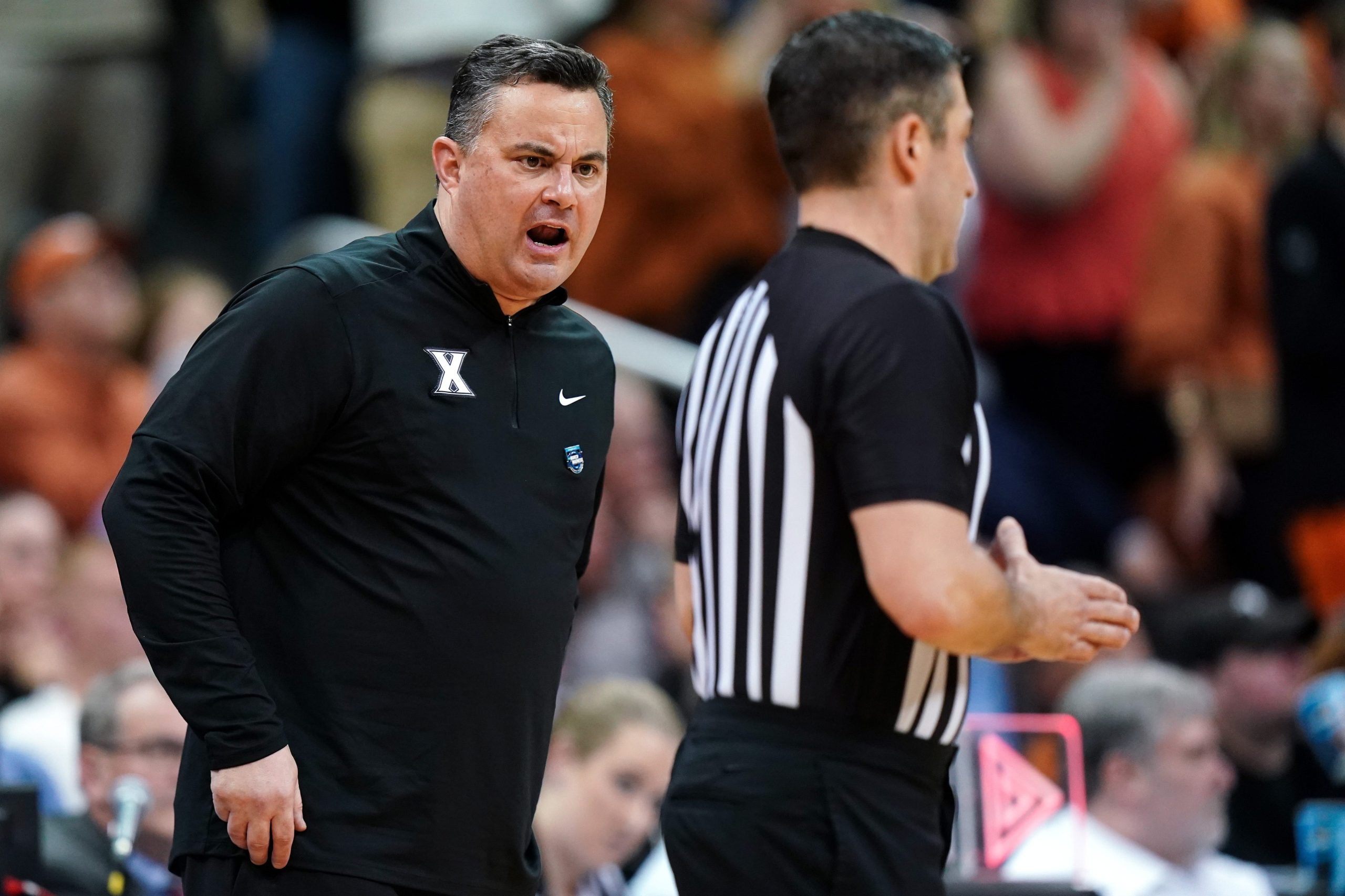 Xavier Musketeers head coach Sean Miller talks with an official during the first half of a Sweet 16 college basketball game between the Xavier Musketeers and the Texas Longhorns in the Midwest Regional of the NCAA Tournament, Friday, March 24, 2023, at T-Mobile Center in Kansas City, Mo. Ncaa Xavier Texas Ncaa Sweet 16 March 24 0365