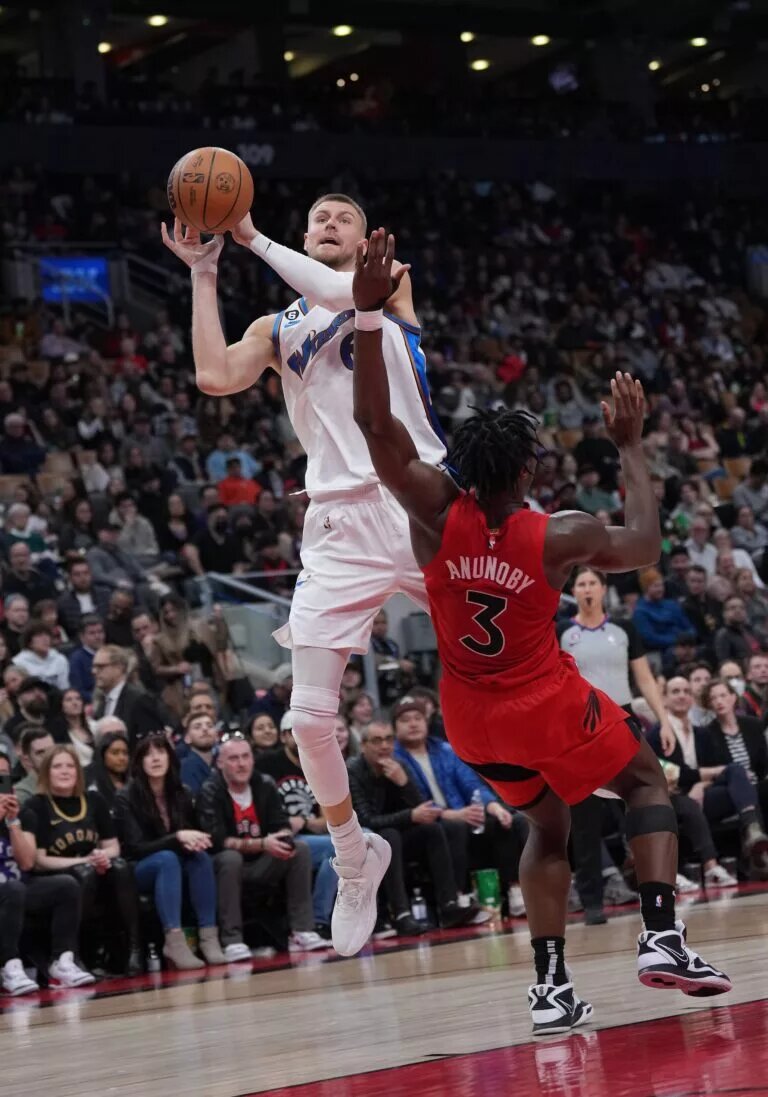 Mar 26, 2023; Toronto, Ontario, CAN; Washington Wizards center Kristaps Porzingis (6) drives to the basket as Toronto Raptors forward O.G. Anunoby (3) tries to defend during the fourth quarter at Scotiabank Arena. Mandatory Credit: Nick Turchiaro-USA TODAY Sports. He is one player expected for Celtics Training Camp