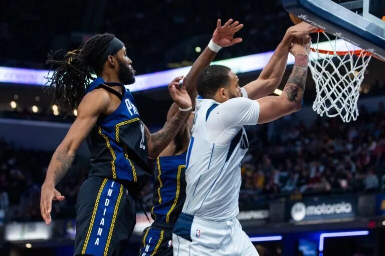 Sacramento Kings News: Mar 27, 2023; Indianapolis, Indiana, USA; Dallas Mavericks center JaVale McGee (00) shoots the ball while Indiana Pacers forward Isaiah Jackson (22) and forward Aaron Nesmith (23) defend in the second quarter at Gainbridge Fieldhouse. Mandatory Credit: Trevor Ruszkowski-USA TODAY Sports