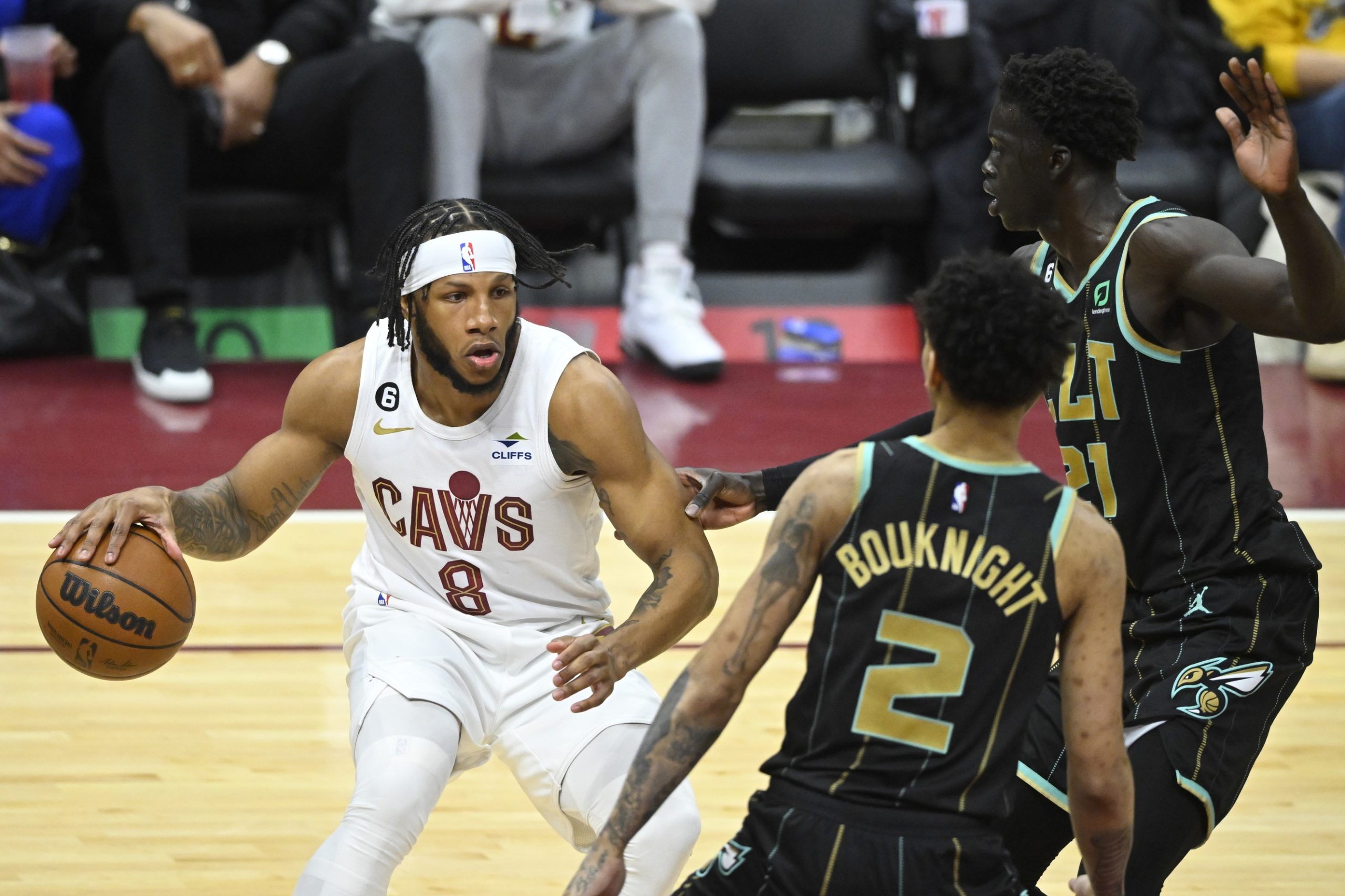 Apr 9, 2023; Cleveland, Ohio, USA; Cleveland Cavaliers forward Lamar Stevens (8) dribbles beside Charlotte Hornets guard James Bouknight (2) and forward JT Thor (21) in the third quarter at Rocket Mortgage FieldHouse. Mandatory Credit: David Richard-USA TODAY Sports