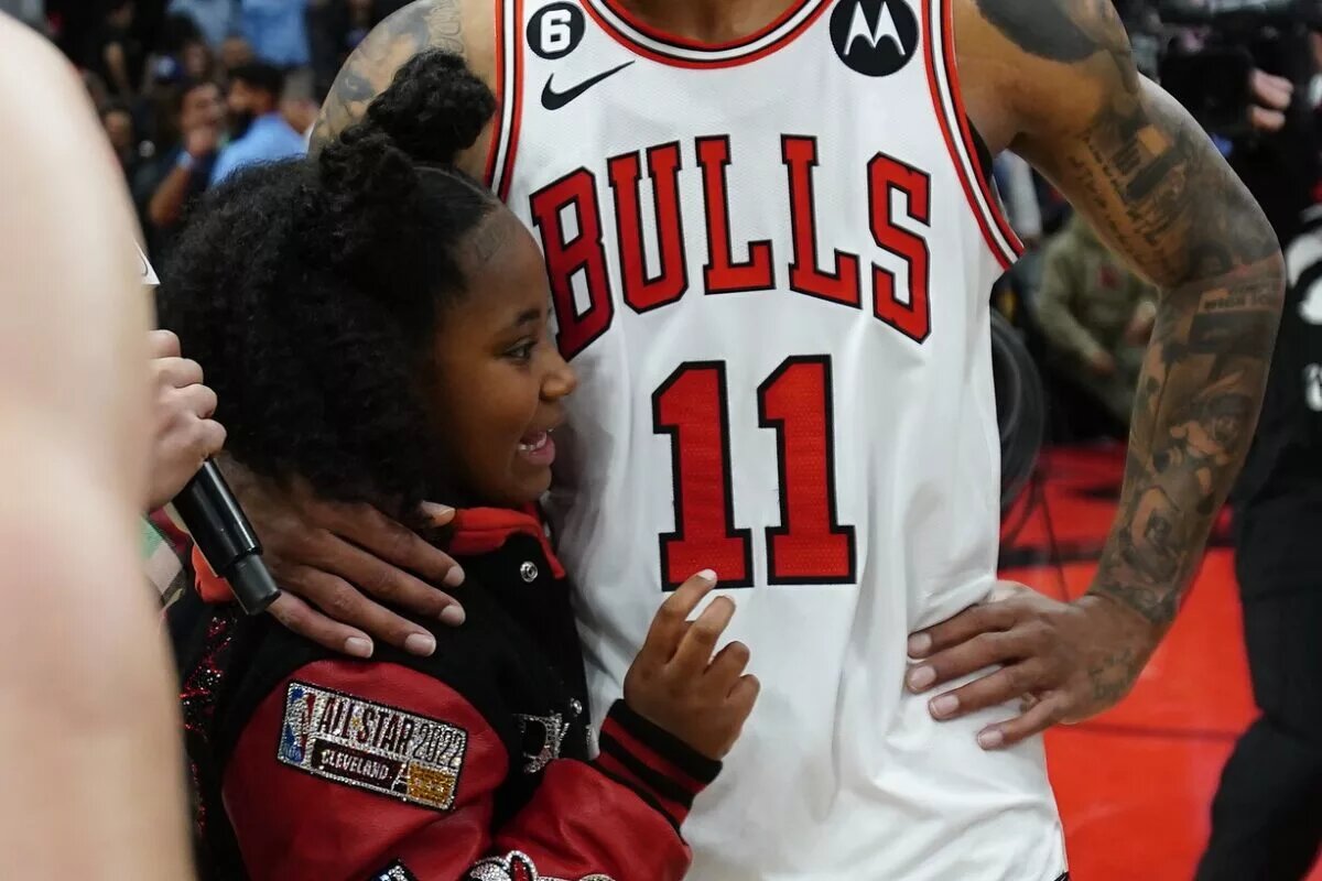 Demar DeRozan's legacy: Apr 12, 2023; Toronto, Ontario, CAN; Chicago Bulls forward DeMar DeRozan (11) gets a hug from his daughter after a win over the Toronto Raptors in the NBA Play-In game at Scotiabank Arena. Mandatory Credit: John E. Sokolowski-USA TODAY Sports