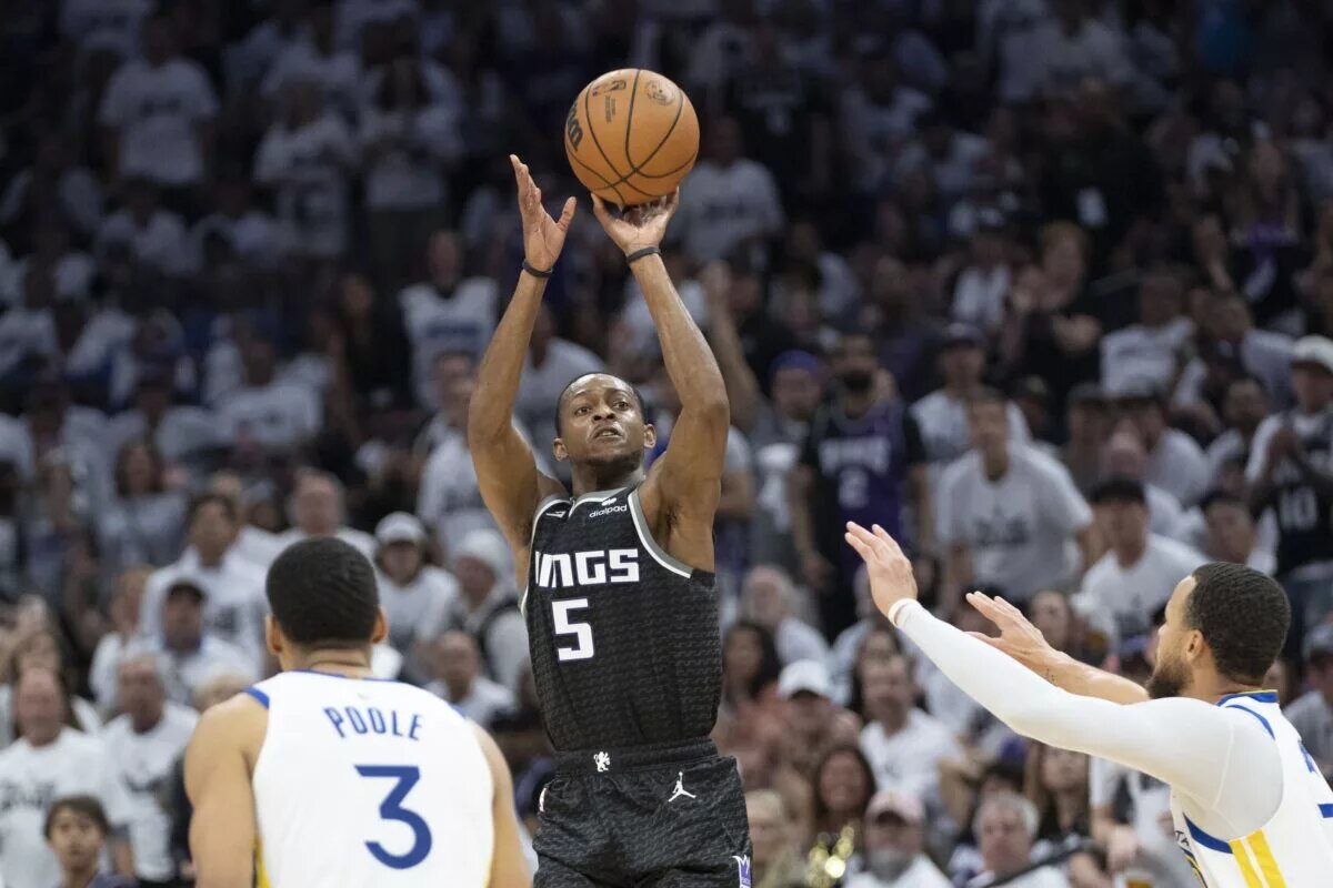 April 30, 2023; Sacramento, California, USA; Sacramento Kings guard De'Aaron Fox (5) shoots the basketball against Golden State Warriors guard Jordan Poole (3) during the second quarter in game seven of the 2023 NBA playoffs first round at Golden 1 Center. Mandatory Credit: Kyle Terada-USA TODAY Sports