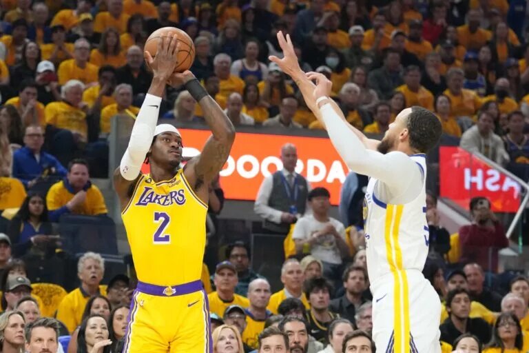 May 10, 2023; San Francisco, California, USA; Los Angeles Lakers forward Jarred Vanderbilt (2) shoots the basketball against Golden State Warriors guard Stephen Curry (30) during the first quarter in game five of the 2023 NBA playoffs conference semifinals round at Chase Center. Mandatory Credit: Kyle Terada-USA TODAY Sports
