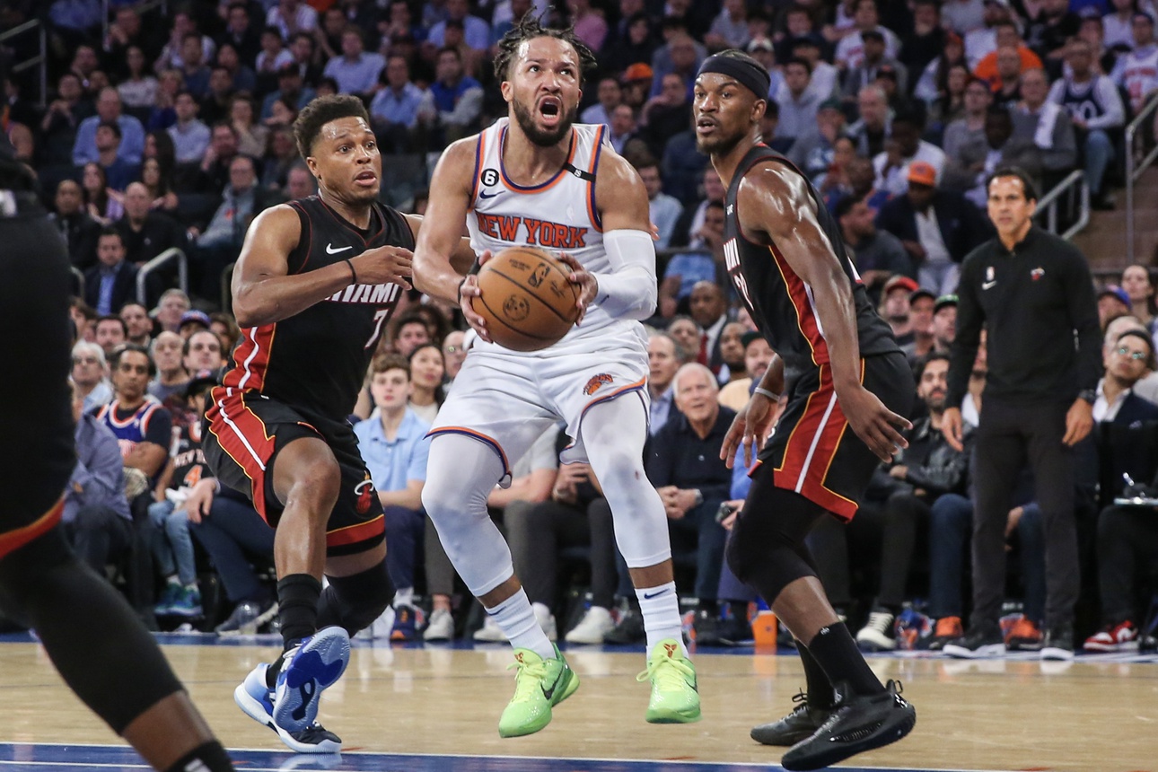 May 10, 2023; New York, New York, USA; New York Knicks guard Jalen Brunson (11) drives past Miami Heat guard Kyle Lowry (7) and forward Jimmy Butler (22) during game five of the 2023 NBA playoffs at Madison Square Garden. Mandatory Credit: Wendell Cruz-USA TODAY Sports