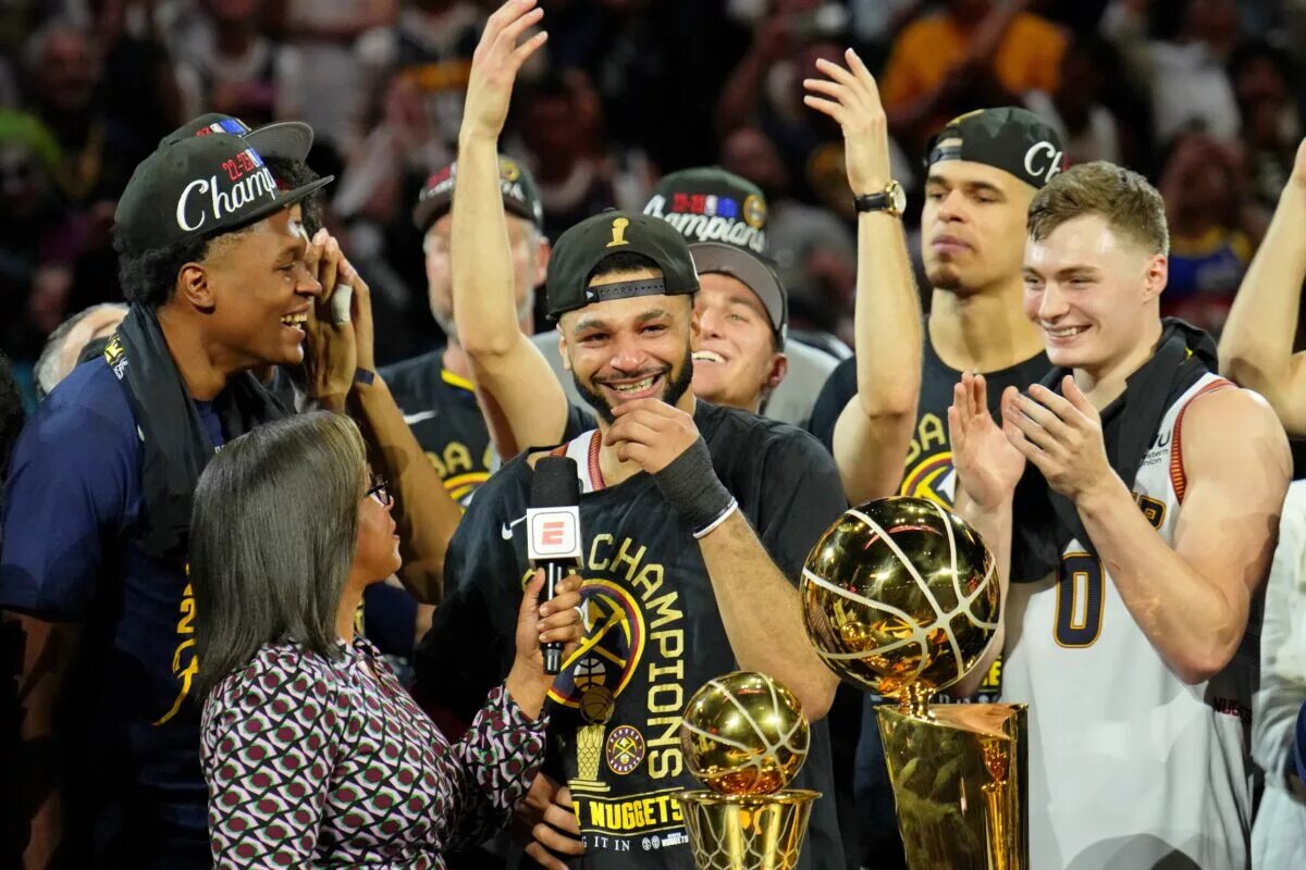 Jun 12, 2023; Denver, Colorado, USA; Denver Nuggets guard Jamal Murray (27) chokes up while being interviewed after winning the 2023 NBA Finals against the Miami Heat at Ball Arena. Mandatory Credit: Kyle Terada-USA TODAY Sports