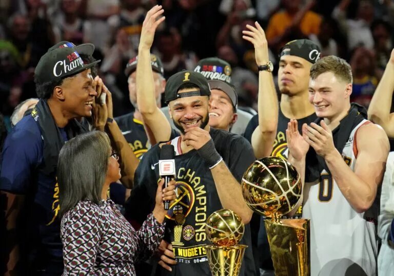 Jun 12, 2023; Denver, Colorado, USA; Denver Nuggets guard Jamal Murray (27) chokes up while being interviewed after winning the 2023 NBA Finals against the Miami Heat at Ball Arena. Mandatory Credit: Kyle Terada-USA TODAY Sports