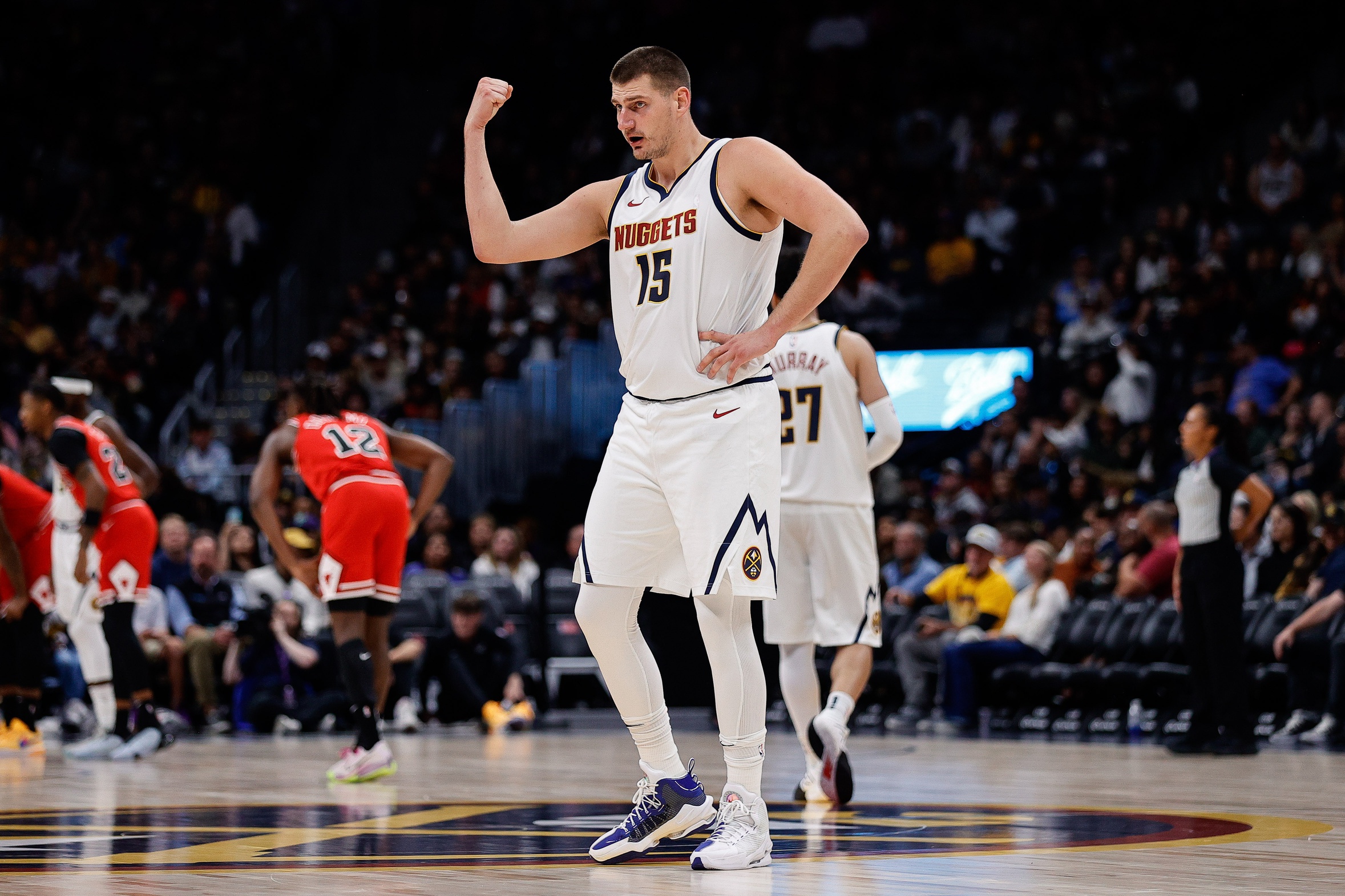 Oct 15, 2023; Denver, Colorado, USA; Denver Nuggets center Nikola Jokic (15) gestures to the bench in the second quarter against the Chicago Bulls at Ball Arena. Mandatory Credit: Isaiah J. Downing-USA TODAY Sports