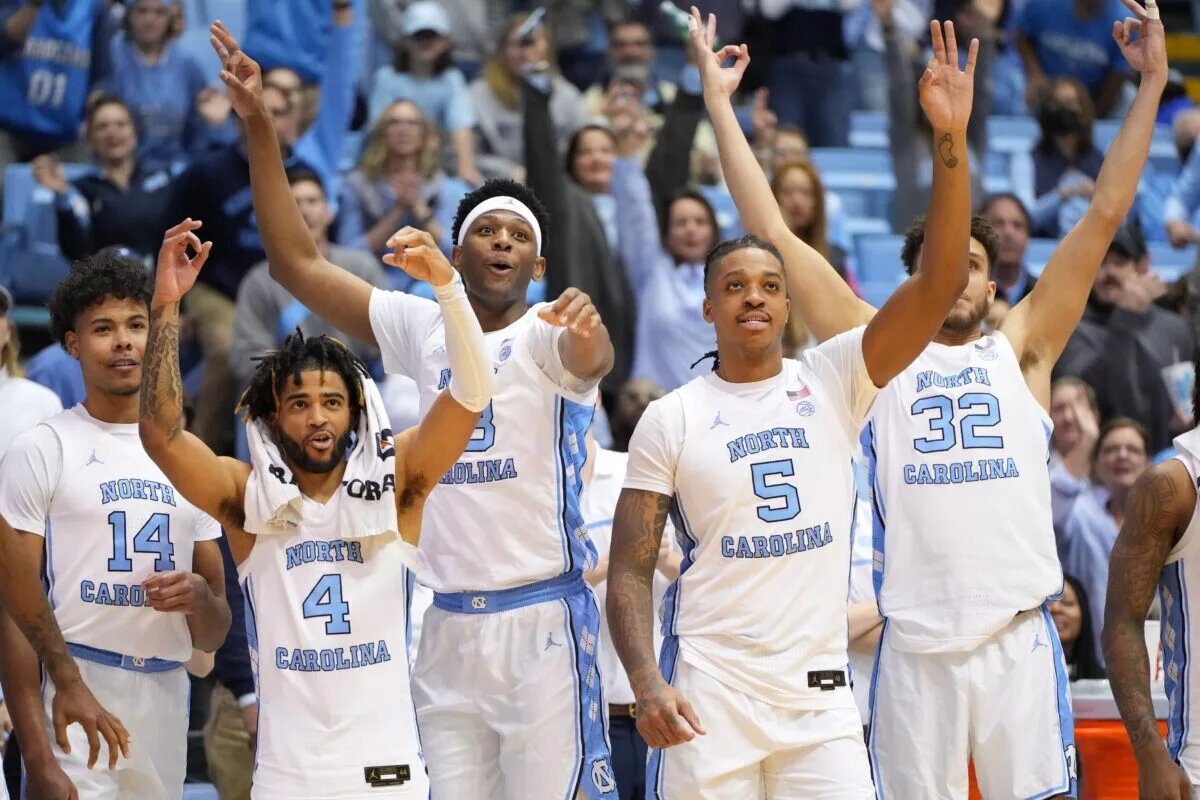 Dec 13, 2022; Chapel Hill, North Carolina, USA; North Carolina Tar Heels forward Puff Johnson (14) and guard R.J. Davis (4) and forward Jalen Washington (13) and forward Armando Bacot (5) and forward Pete Nance (32) react in the second half at Dean E. Smith Center. Mandatory Credit: Bob Donnan-USA TODAY Sports