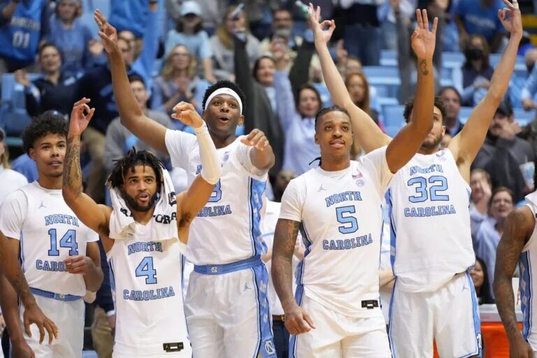 Dec 13, 2022; Chapel Hill, North Carolina, USA; North Carolina Tar Heels forward Puff Johnson (14) and guard R.J. Davis (4) and forward Jalen Washington (13) and forward Armando Bacot (5) and forward Pete Nance (32) react in the second half at Dean E. Smith Center. Mandatory Credit: Bob Donnan-USA TODAY Sports