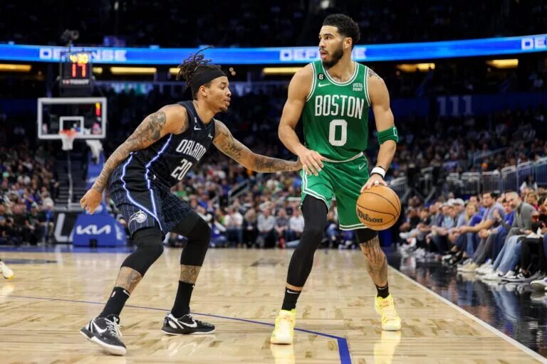 Jan 23, 2023; Orlando, Florida, USA; Orlando Magic guard Markelle Fultz (20) guards Boston Celtics forward Jayson Tatum (0) in the second quarter at Amway Center. Mandatory Credit: Nathan Ray Seebeck-USA TODAY Sports
