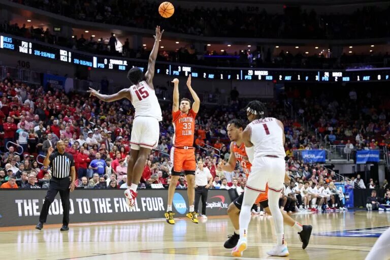 Illinois Fighting Illini forward Coleman Hawkins (33) shoots the ball against Arkansas Razorbacks forward Makhi Mitchell (15) during the first half at Wells Fargo Arena.