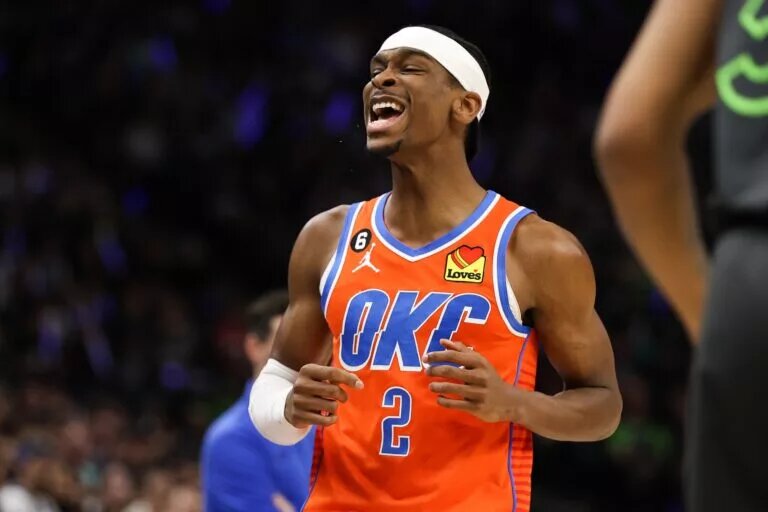 Apr 14, 2023; Minneapolis, Minnesota, USA; Oklahoma City Thunder guard Shai Gilgeous-Alexander (2) reacts to his shot against the Minnesota Timberwolves during the first quarter at Target Center. Mandatory Credit: Matt Krohn-USA TODAY Sports