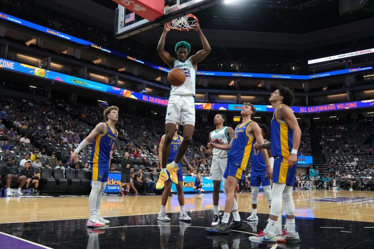 Jul 5, 2023; Sacramento, CA, USA; Charlotte Hornets forward Kai Jones (center) dunks against the Golden State Warriors during the fourth quarter at Golden 1 Center. Mandatory Credit: Darren Yamashita-USA TODAY Sports
