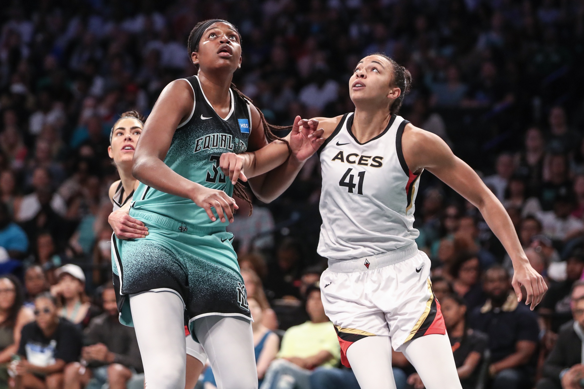 Aug 6, 2023; Brooklyn, New York, USA; New York Liberty forward Jonquel Jones (35) and Las Vegas Aces center Kiah Stokes (41) box out for a rebound in the first quarter at Barclays Center. Mandatory Credit: Wendell Cruz-USA TODAY Sports. Here is a WNBA Final Preview