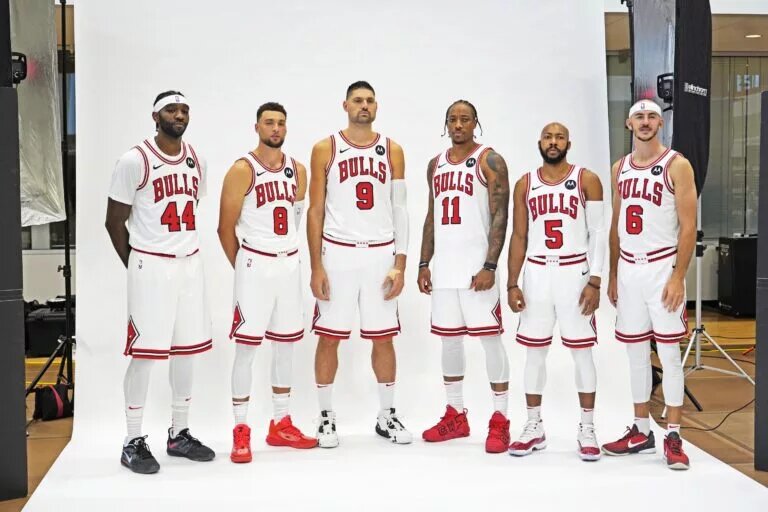 Oct 2, 2023; Chicago, IL, USA; (L-R) Chicago Bulls forward Patrick Williams (44), guard Zach LaVine (8), center Nikola Vucevic (9), forward DeMar DeRozan (11), guard Jevon Carter (5), and guard Alex Caruso (6) during Chicago Bulls Media Day at Advocate Center. Mandatory Credit: David Banks-USA TODAY Sports