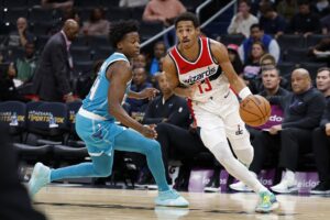 Oct 12, 2023; Washington, District of Columbia, USA; Washington Wizards guard Jordan Poole (13) drives to the basket as Charlotte Hornets guard Frank Ntilikina (44) defends in the third quarter at Capital One Arena. Mandatory Credit: Geoff Burke-USA TODAY Sports