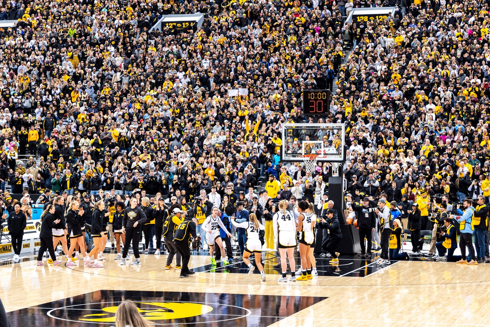 Iowa guard Caitlin Clark (22) is introduced during the Crossover at Kinnick women's basketball scrimmage between Iowa and DePaul, Sunday, Oct. 15, 2023, at Kinnick Stadium in Iowa City, Iowa.
