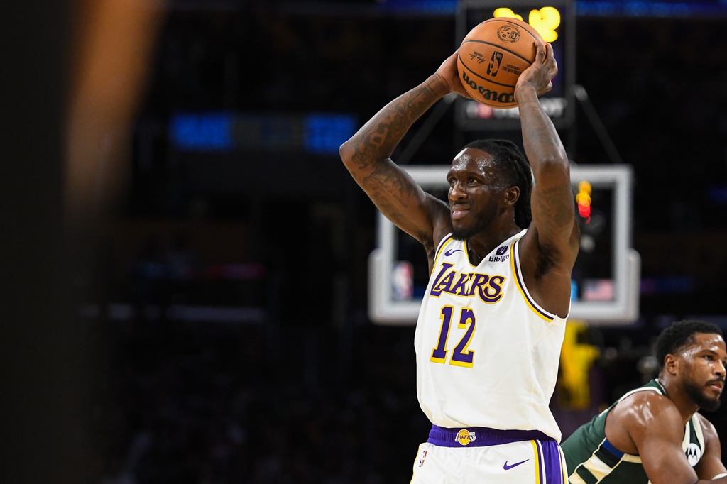 Oct 15, 2023; Los Angeles, California, USA; Los Angeles Lakers forward Taurean Prince (12) looking to pass the ball in the second quarter against the Milwaukee Bucks at Crypto.com Arena. Mandatory Credit: Jonathan Hui-USA TODAY Sports
