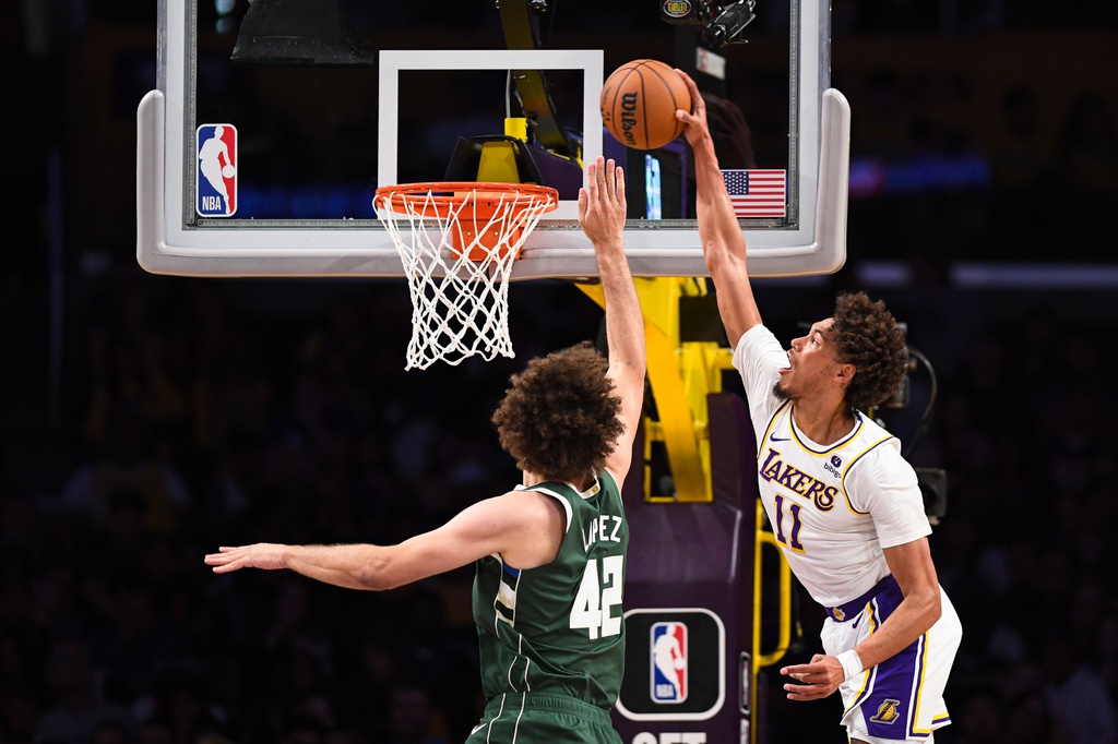 Oct 15, 2023; Los Angeles, California, USA; Milwaukee Bucks center Robin Lopez (42) defends against Los Angeles Lakers center Jaxson Hayes (11) in the second half at Crypto.com Arena. Mandatory Credit: Jonathan Hui-USA TODAY Sports