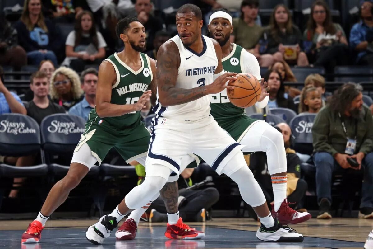 Oct 10, 2023; Memphis, Tennessee, USA; Memphis Grizzlies forward Xavier Tillman (2) as Milwaukee Bucks guard Cameron Payne (15) defends during the first half at FedExForum. Mandatory Credit: Petre Thomas-USA TODAY Sports
