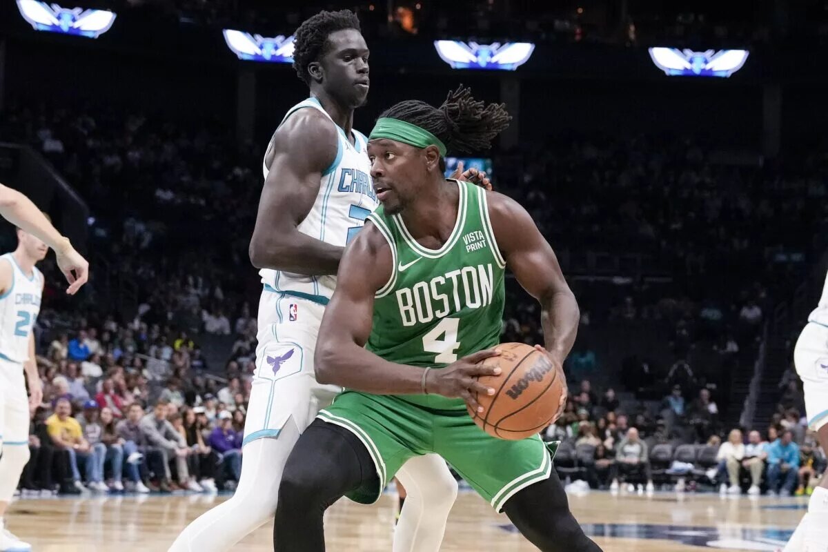 Oct 19, 2023; Charlotte, North Carolina, USA; Boston Celtics guard Jrue Holiday (4) drives against Charlotte Hornets forward JT Thor (21) during the second quarter at Spectrum Center. Mandatory Credit: Jim Dedmon-USA TODAY Sports
