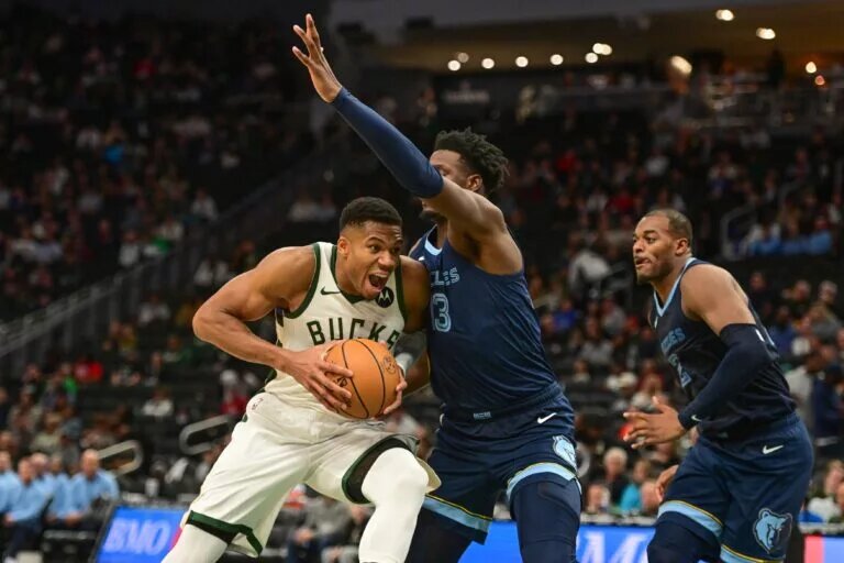 Oct 20, 2023; Milwaukee, Wisconsin, USA; Milwaukee Bucks forward Giannis Antetokounmpo (34) drives for the basket against Memphis Grizzlies forward Jaren Jackson Jr. (13) in the third quarter at Fiserv Forum. Mandatory Credit: Benny Sieu-USA TODAY Sports