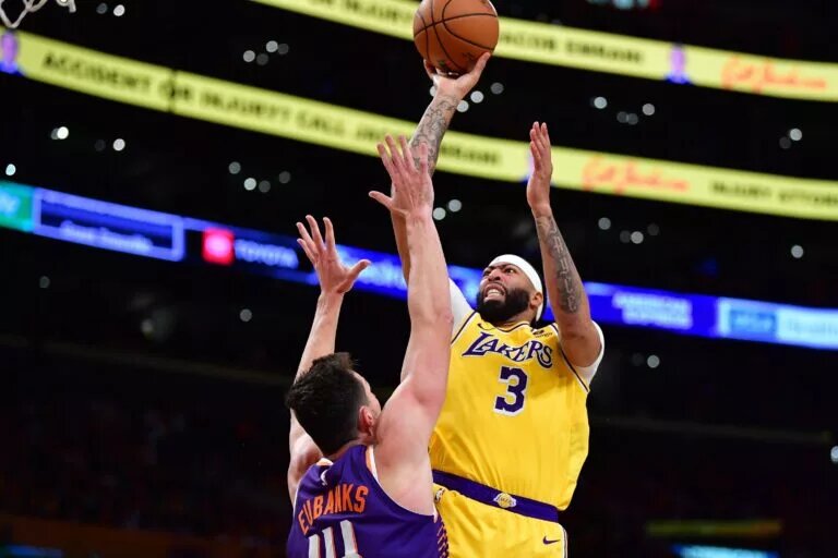 Oct 26, 2023; Los Angeles, California, USA; Los Angeles Lakers forward Anthony Davis (3) shoots against Phoenix Suns forward Drew Eubanks (14) during the second half at Crypto.com Arena. Mandatory Credit: Gary A. Vasquez-USA TODAY Sports