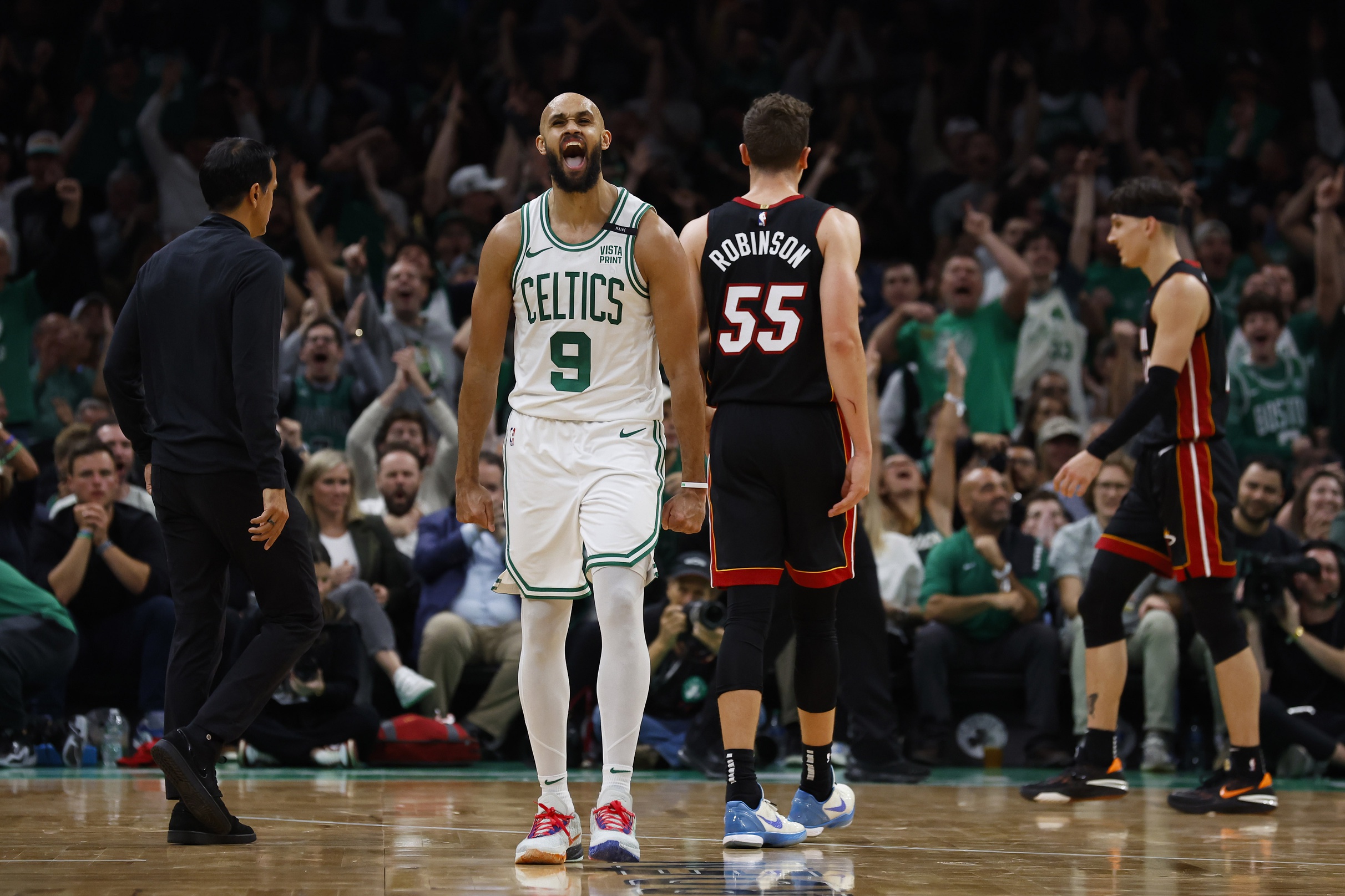Oct 27, 2023; Boston, Massachusetts, USA; Boston Celtics guard Derrick White (9) shouts out after hitting a three point basket against the Miami Heat during the fourth quarter at TD Garden.
