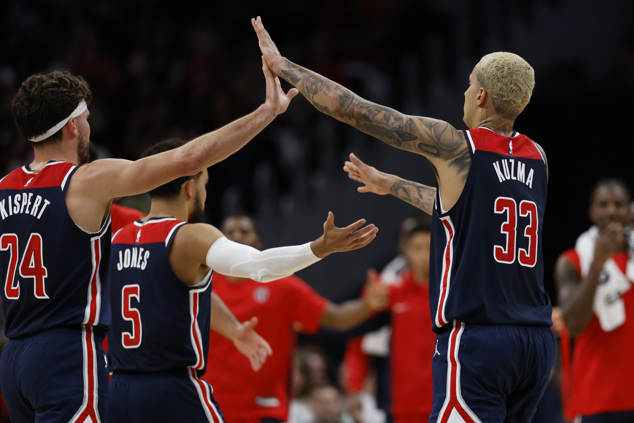 Oct 28, 2023; Washington, District of Columbia, USA; Washington Wizards forward Kyle Kuzma (33) celebrates with Wizards forward Corey Kispert (24) against the Memphis Grizzlies in the second quarter at Capital One Arena. Mandatory Credit: Geoff Burke-USA TODAY Sports