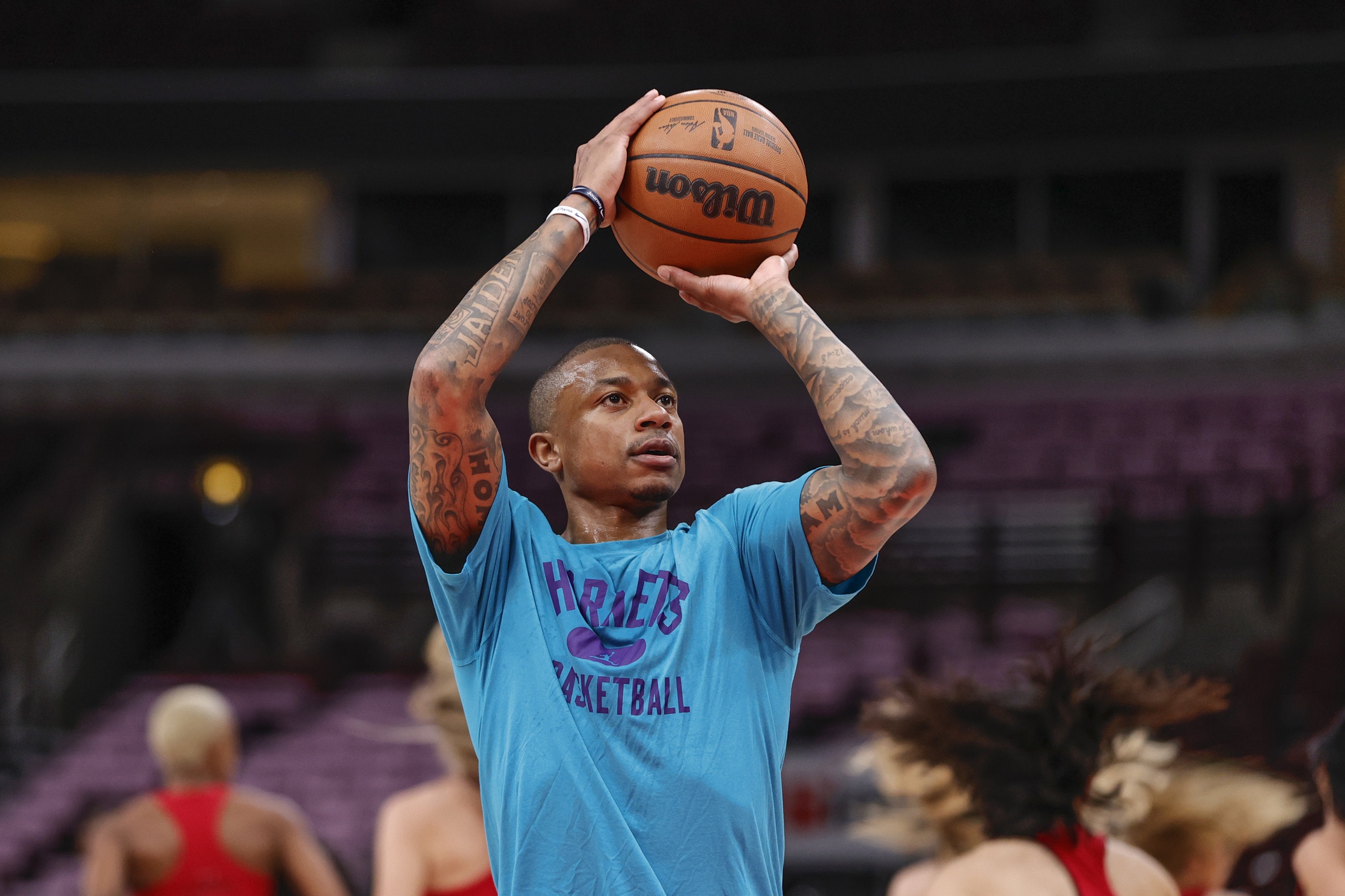 Charlotte Hornets guard Isaiah Thomas (4) warms up before an NBA game against the Chicago Bulls at United Center.