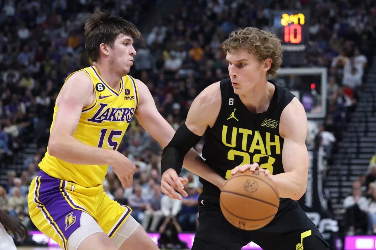 Nov 7, 2022; Salt Lake City, Utah, USA; Utah Jazz forward Lauri Markkanen (23) drives against Los Angeles Lakers guard Austin Reaves (15) in the second quarter at Vivint Arena. Mandatory Credit: Rob Gray-USA TODAY Sports