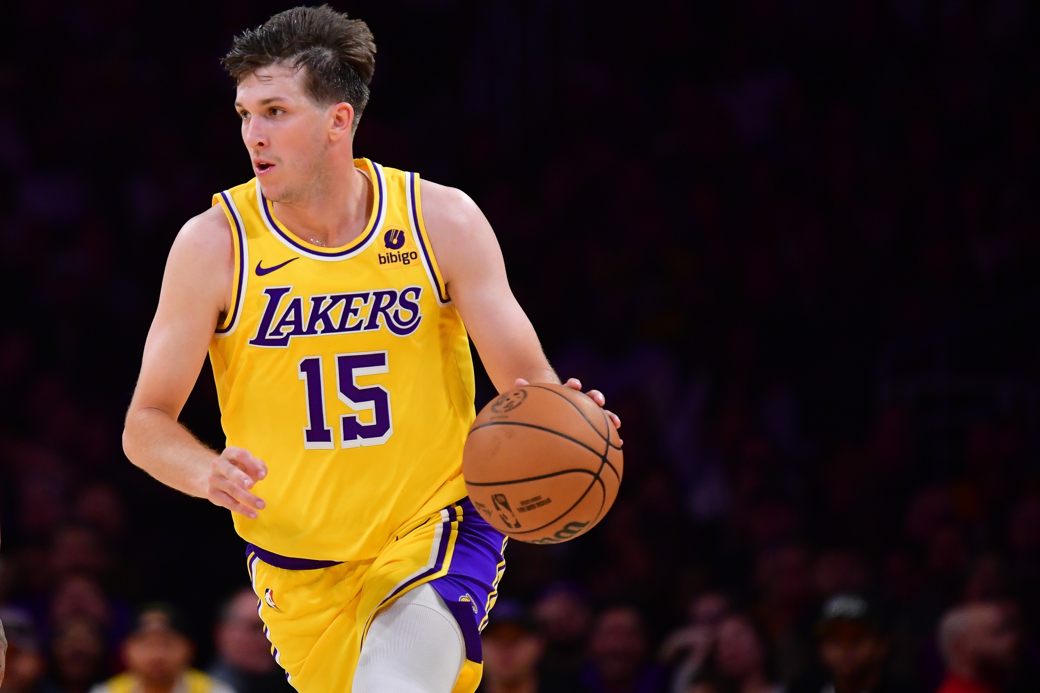 Oct 30, 2023; Los Angeles, California, USA; Los Angeles Lakers guard Austin Reaves (15) moves the ball up court against the Orlando Magic during the second half at Crypto.com Arena. Mandatory Credit: Gary A. Vasquez-USA TODAY Sports