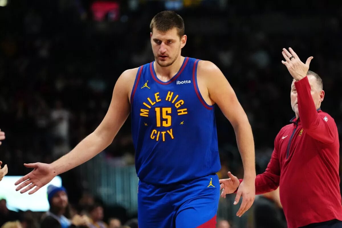 Denver Nuggets center Nikola Jokic (15) leaves the court in the fourth quarter against the Chicago Bulls at Ball Arena.