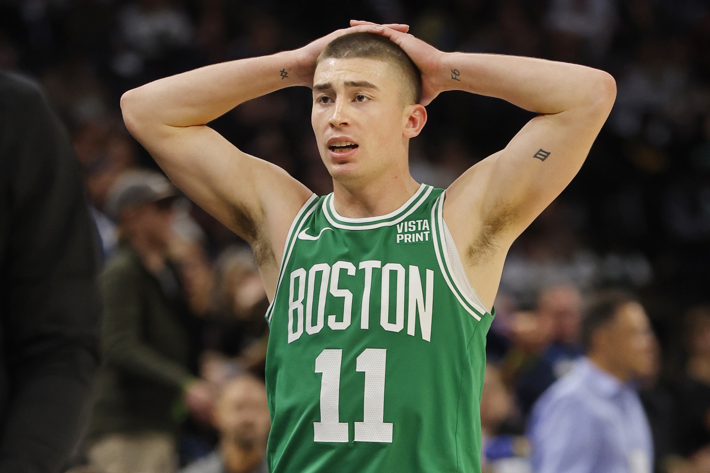 Boston Celtics guard Payton Pritchard (11) reacts to a foul call in the third quarter of the game against the Minnesota Timberwolves at Target Center.