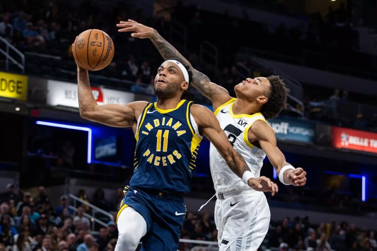 Indiana Pacers forward Bruce Brown (11) shoots the ball while Utah Jazz guard Keyonte George (3) defends in the second half at Gainbridge Fieldhouse.