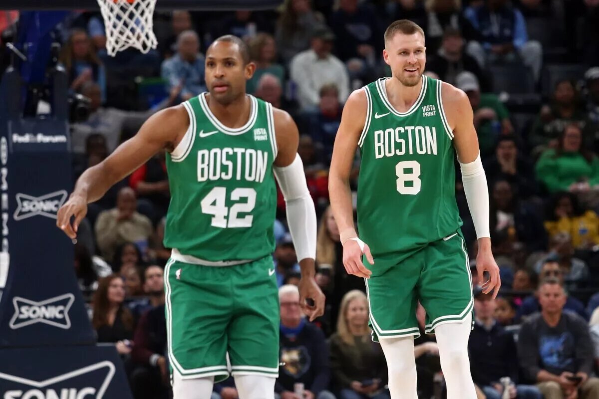Boston Celtics center Al Horford (42) and center Kristaps Porzingis (8) get back on defense during the first half against the Memphis Grizzlies at FedExForum.