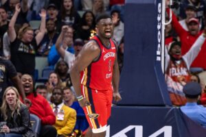 New Orleans, Louisiana, USA; New Orleans Pelicans forward Zion Williamson (1) reacts to dunking the ball against the Sacramento Kings during the second half at the Smoothie King Center.
