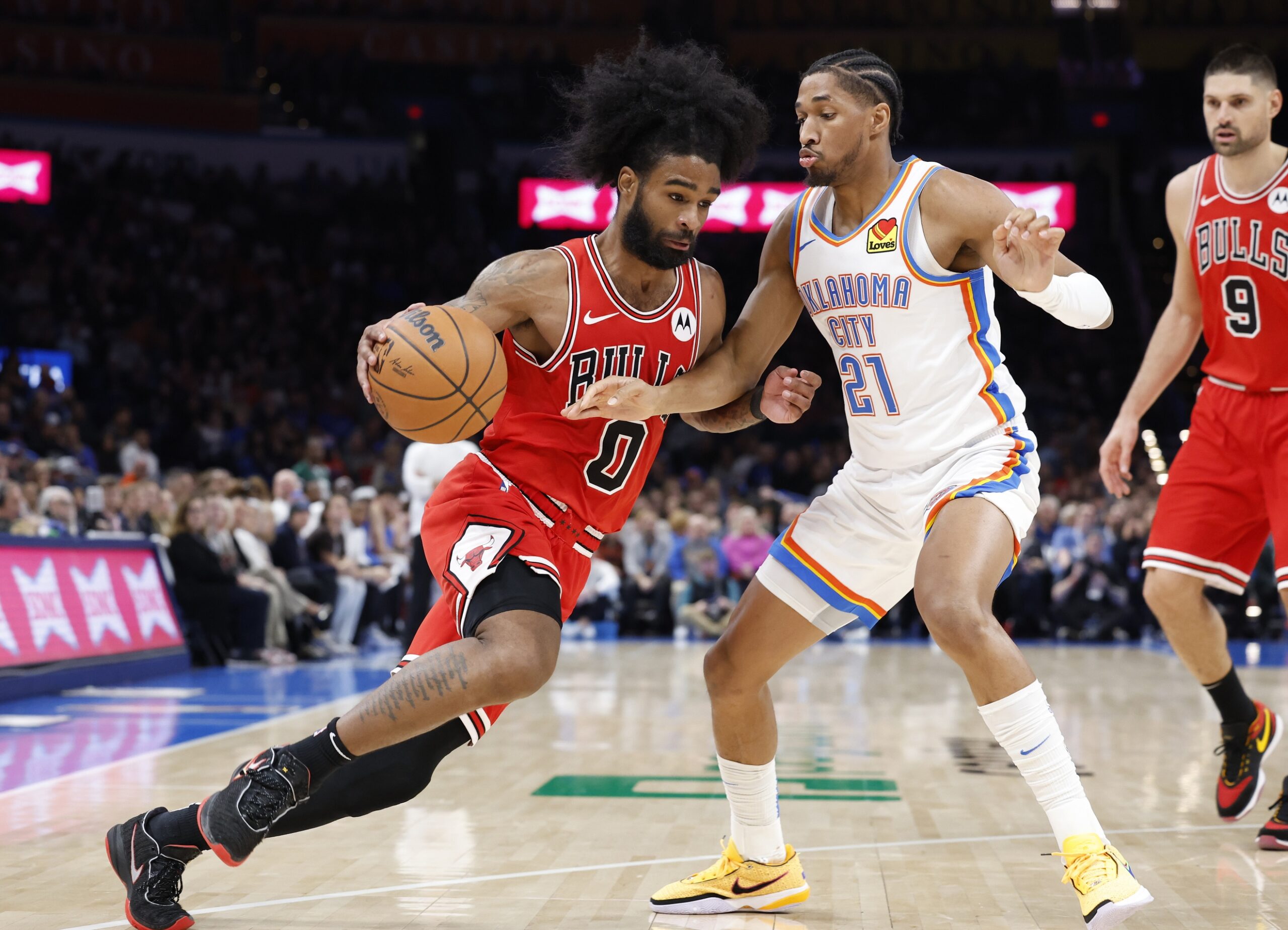 Chicago Bulls guard Coby White (0) drives against Oklahoma City Thunder guard Aaron Wiggins (21) during the second half at Paycom Center.
