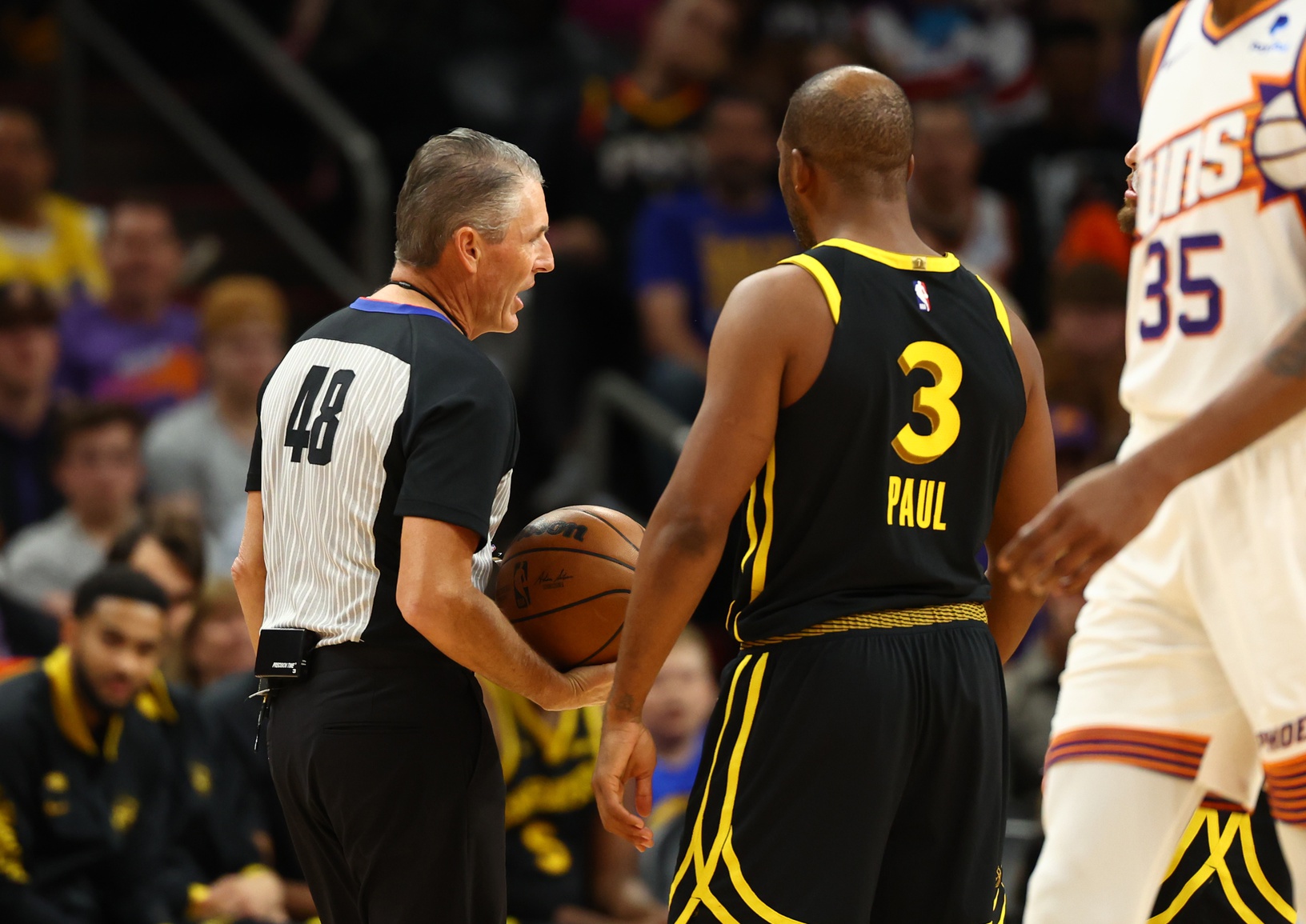 Nov 22, 2023; Phoenix, Arizona, USA; Golden State Warriors guard Chris Paul (3) argues with NBA referee Scott Foster after getting a technical foul against the Phoenix Suns in the first half at Footprint Center. Mandatory Credit: Mark J. Rebilas-USA TODAY Sports