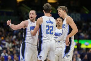 Orlando Magic guard Joe Ingles (7) leads a team huddle against the Charlotte Hornets in the second quarter at Amway Center.