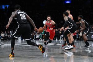Chicago Bulls guard Zach LaVine (8) drives as Brooklyn Nets forward Dorian Finney-Smith (28) and Brooklyn Nets forward Trendon Watford (9) defend during the fourth quarter at Barclays Center.
