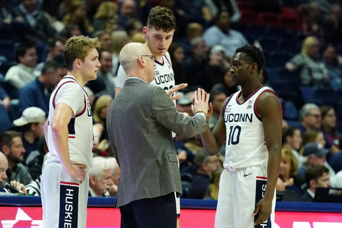 UConn Huskies head coach Dan Hurley talks with guard Hassan Diarra (10), center Donovan Clingan (32) AND guard Cam Spencer (12) from the sideline as they take on the New Hampshire Wildcats at Harry A. Gampel Pavilion.