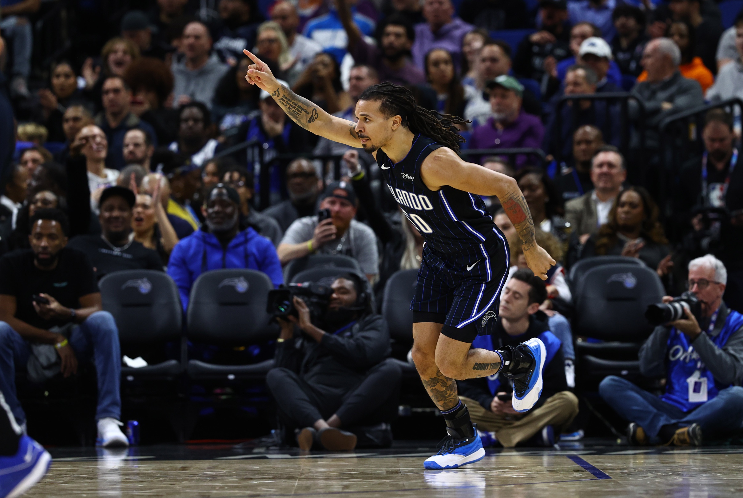 Orlando Magic guard Cole Anthony (50) celebrates after he makes a three-pointer against the Washington Wizards during the second half at Amway Center.