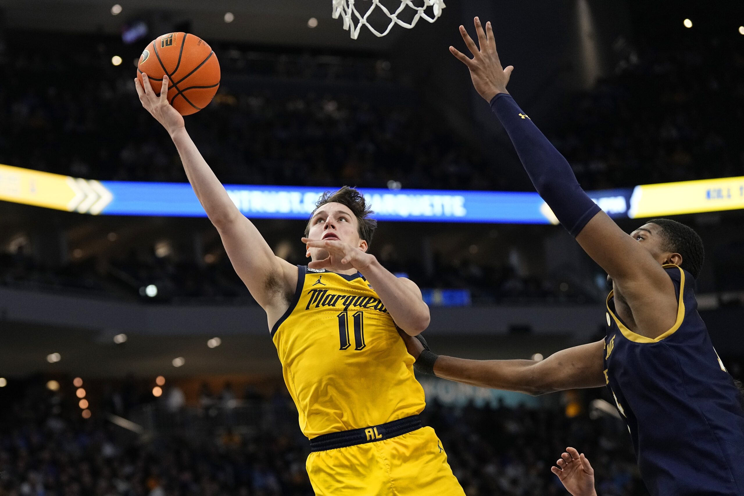 Marquette Golden Eagles guard Tyler Kolek (11) shoots during the second half against the Notre Dame Fighting Irish at Fiserv Forum.