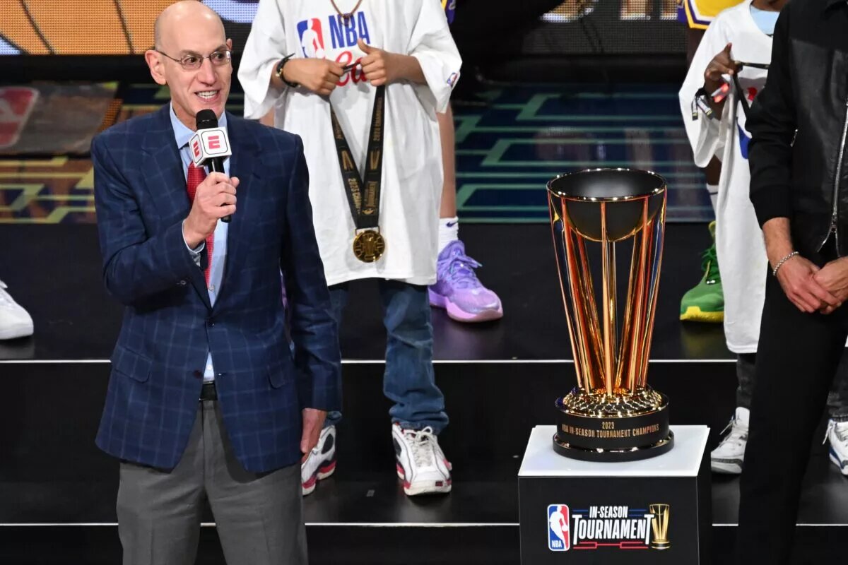 NBA commissioner Adam Silver presents the NBA Cup to the Los Angeles Lakers after winning the NBA In-Season Tournament Championship game against the Indiana Pacers at T-Mobile Arena.