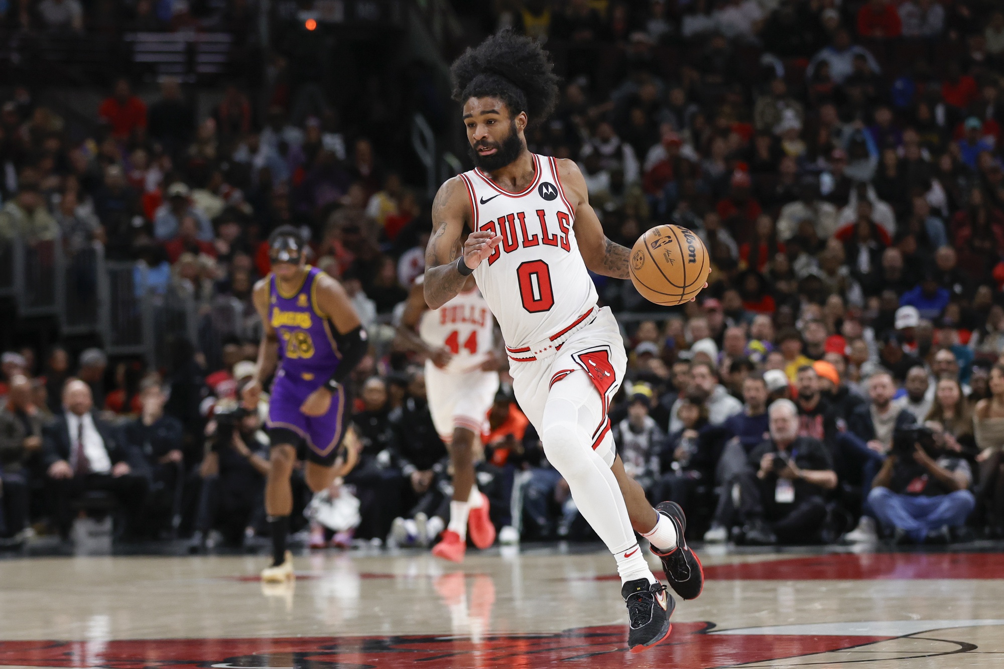 Dec 20, 2023; Chicago, Illinois, USA; Chicago Bulls guard Coby White (0) brings the ball up court against the Los Angeles Lakers during the first half at United Center. Mandatory Credit: Kamil Krzaczynski-USA TODAY Sports
