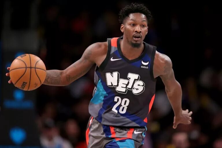 Dec 20, 2023; Brooklyn, New York, USA; Brooklyn Nets forward Dorian Finney-Smith (28) brings the ball up court against the New York Knicks during the fourth quarter at Barclays Center. Mandatory Credit: Brad Penner-USA TODAY Sports