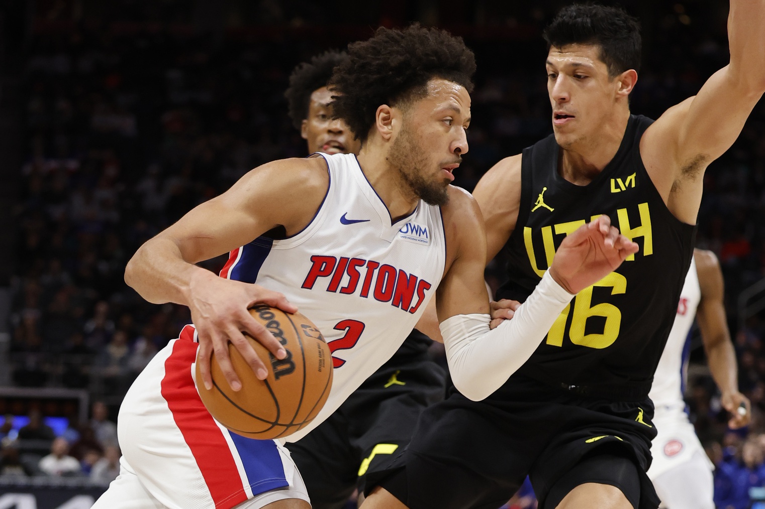 Dec 21, 2023; Detroit, Michigan, USA; Detroit Pistons guard Cade Cunningham (2) dribbles defended by Utah Jazz forward Simone Fontecchio (16) in the first half at Little Caesars Arena. Mandatory Credit: Rick Osentoski-USA TODAY Sports